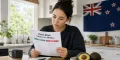 Person reviewing keto diet facts and myths in a New Zealand kitchen